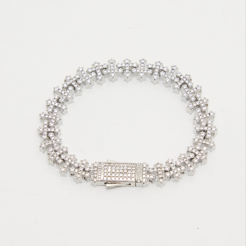 Silver bracelet with clear stones on a white background