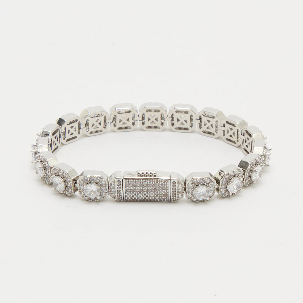 Silver bracelet with gemstones on a white background