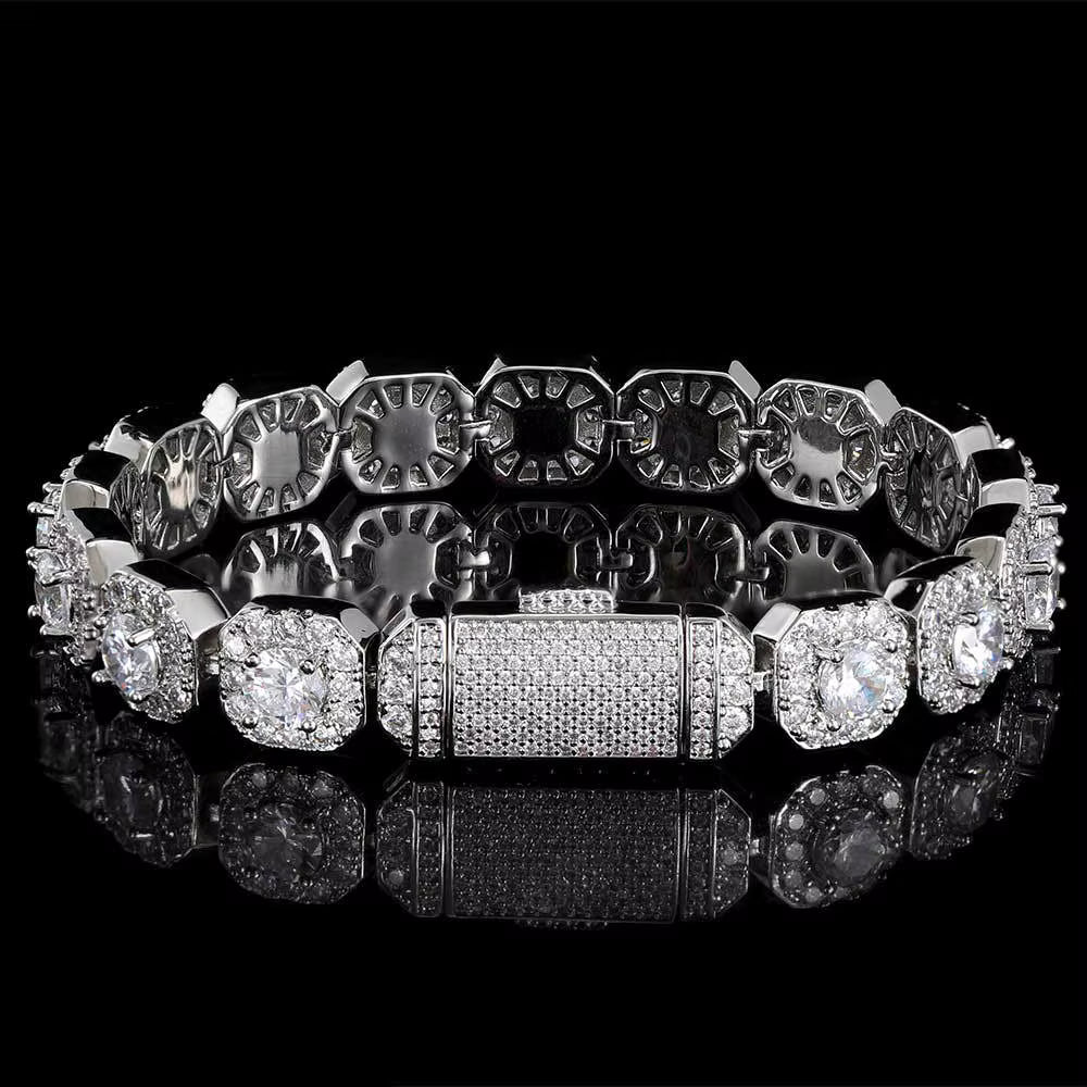 Silver bracelet with diamond accents on a black background
