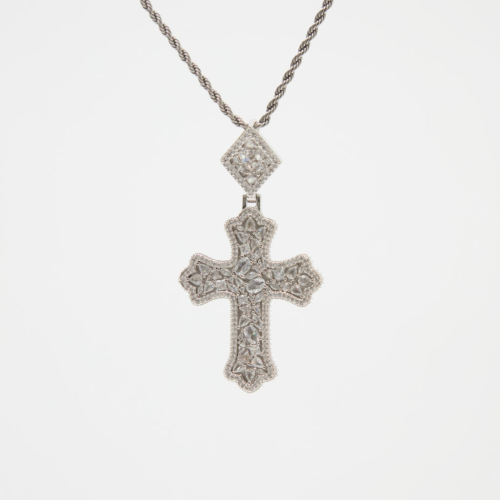 Silver cross pendant necklace on a white background