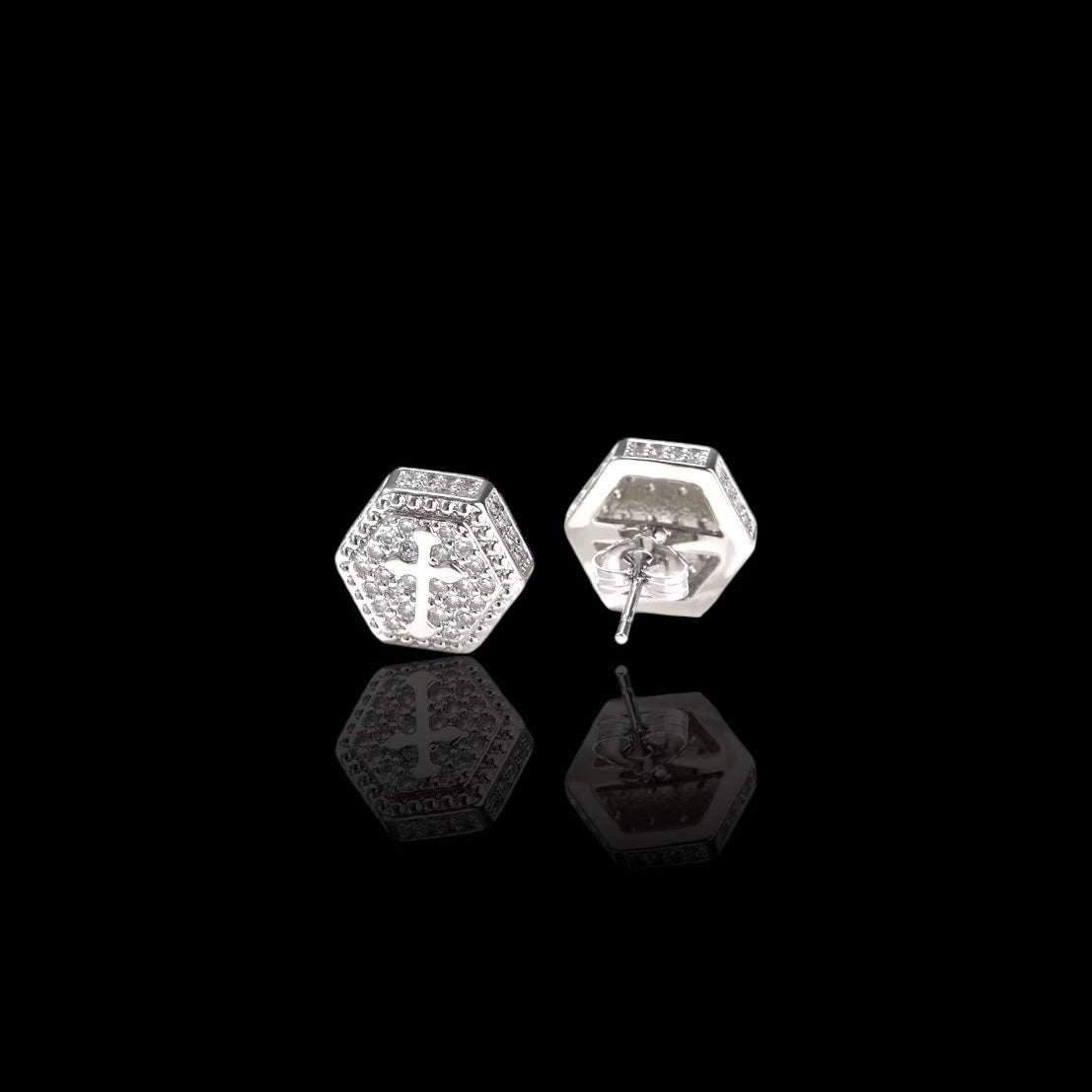 Hexagonal stud earrings on a black background