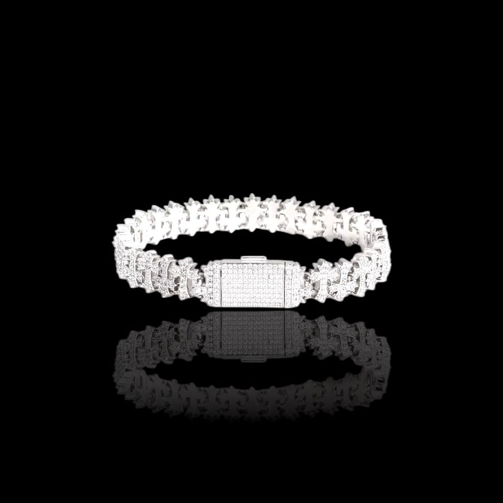 Silver ring with clear stones on a black background