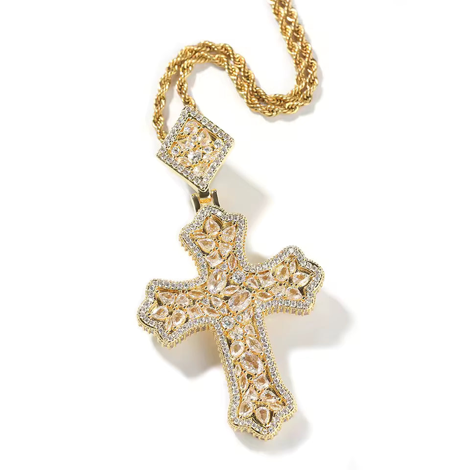 Gold cross pendant necklace on a white background