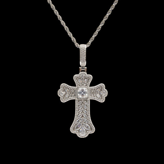 Silver cross pendant necklace on a black background