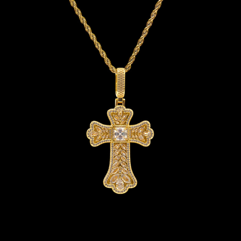 Gold cross pendant necklace on a black background