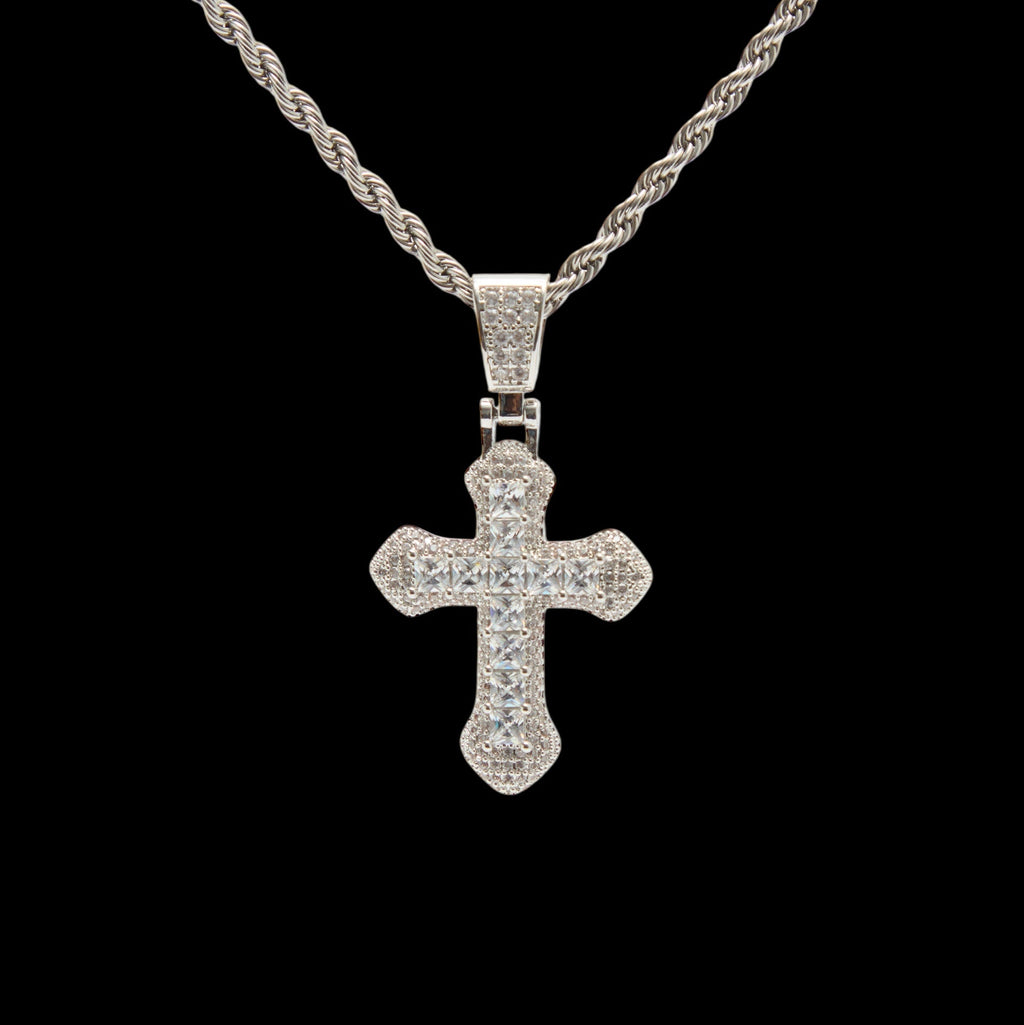 Silver cross pendant necklace on a black background