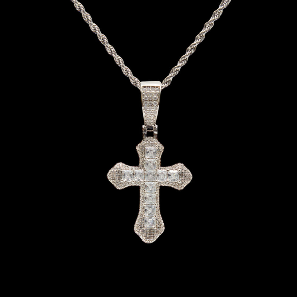 Silver cross pendant necklace on a black background