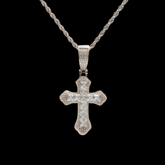 Silver cross pendant necklace on a black background