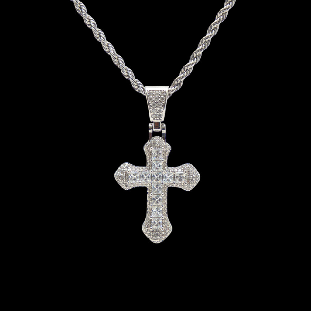 Silver cross pendant necklace on a black background