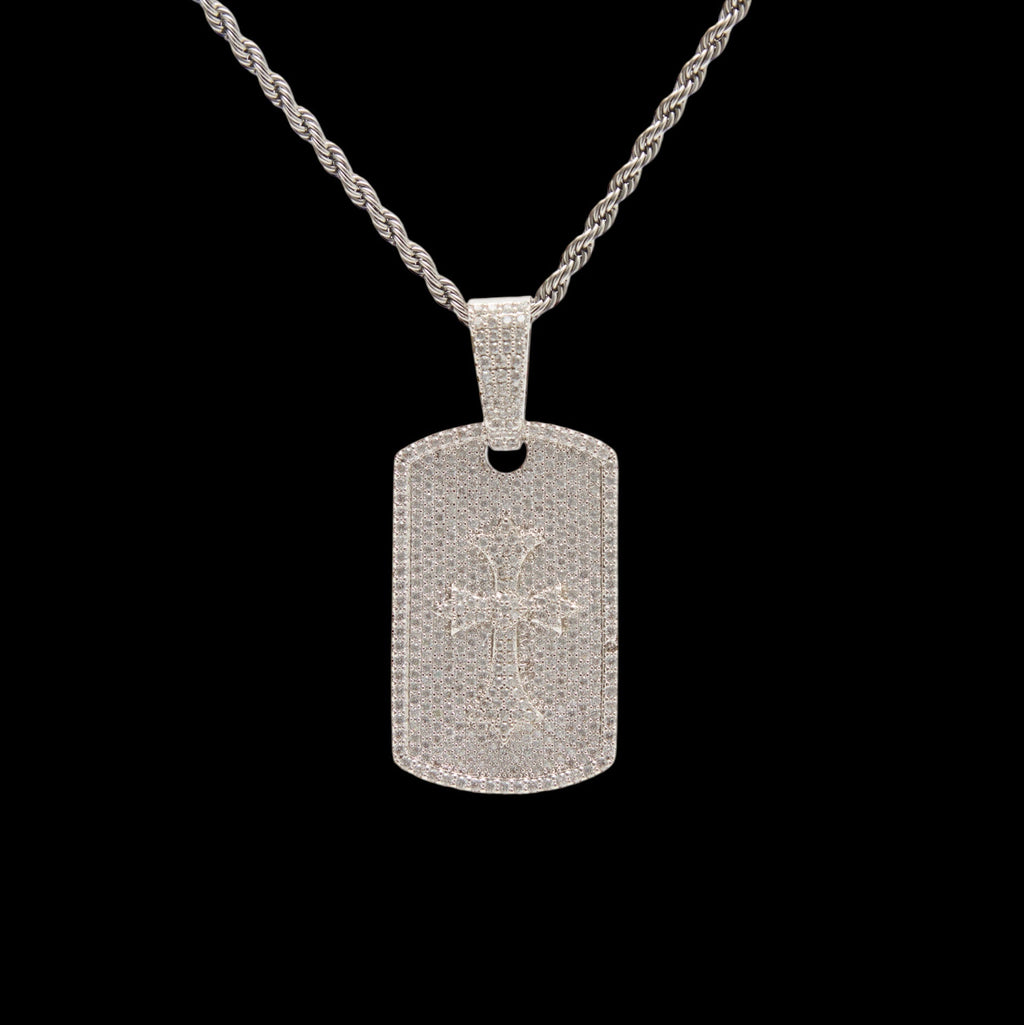 Silver dog tag pendant on a black background