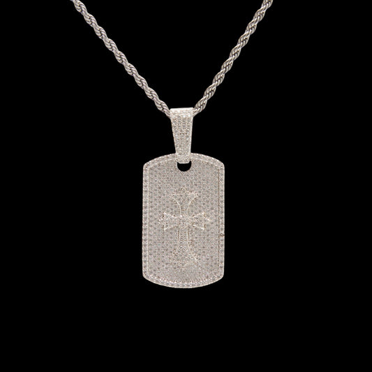 Silver dog tag pendant on a black background