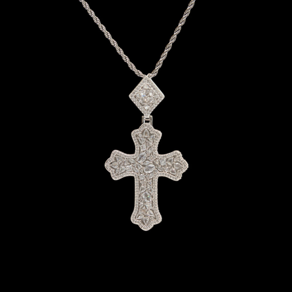 Silver cross pendant necklace on a black background