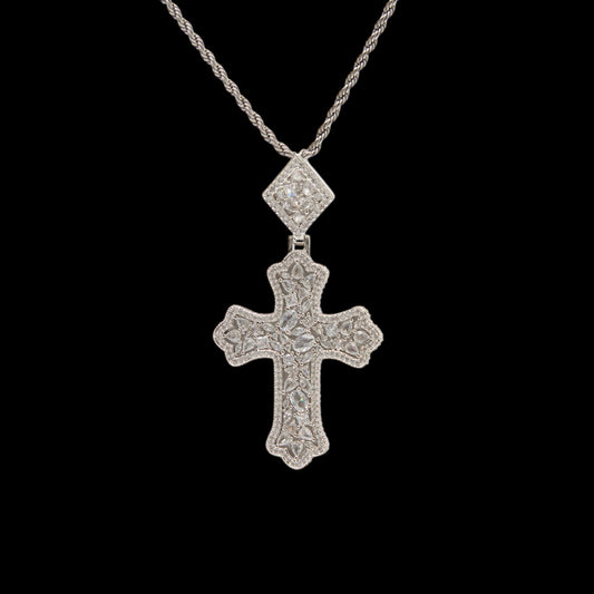 Silver cross pendant necklace on a black background