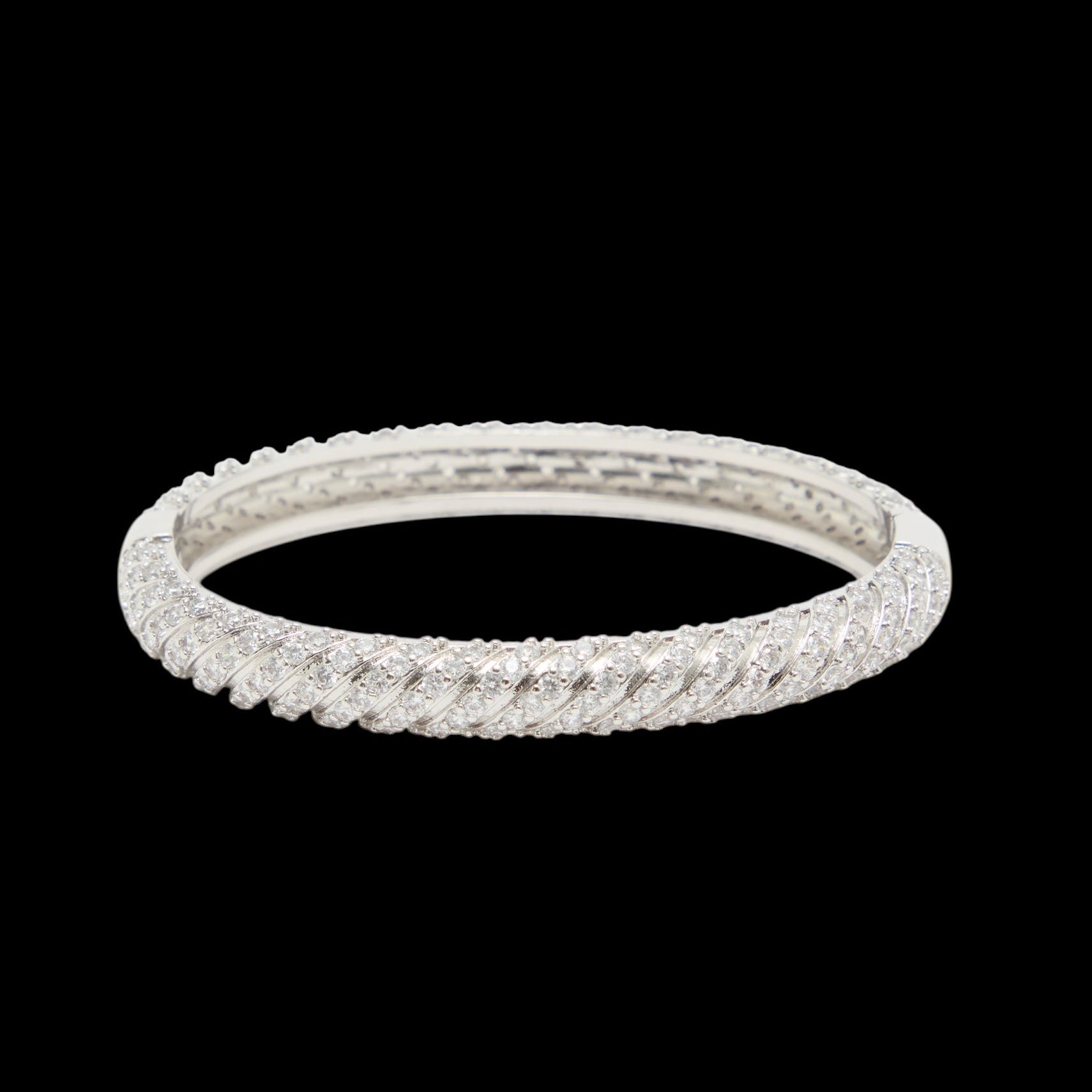 Silver bracelet on a black background