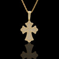 Gold cross pendant necklace on a black background