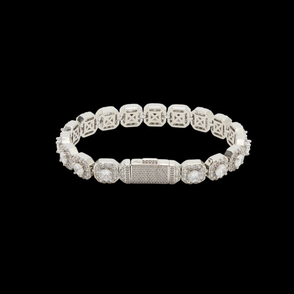 Silver bracelet with clear stones on a black background