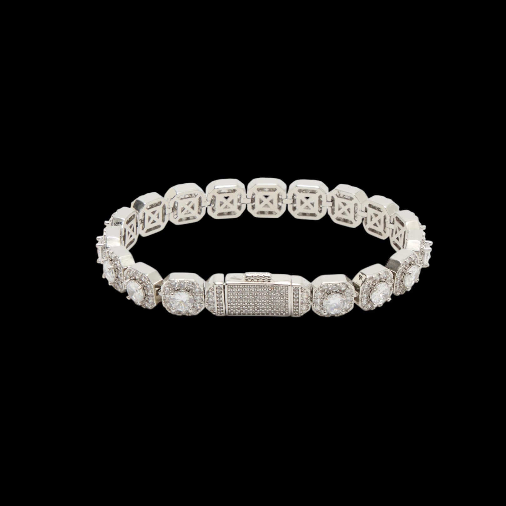 Silver bracelet with clear stones on a black background